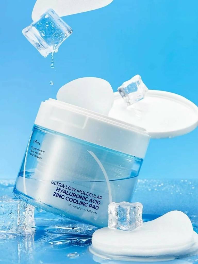 Cosmetic pad with ice cubes on a blue background