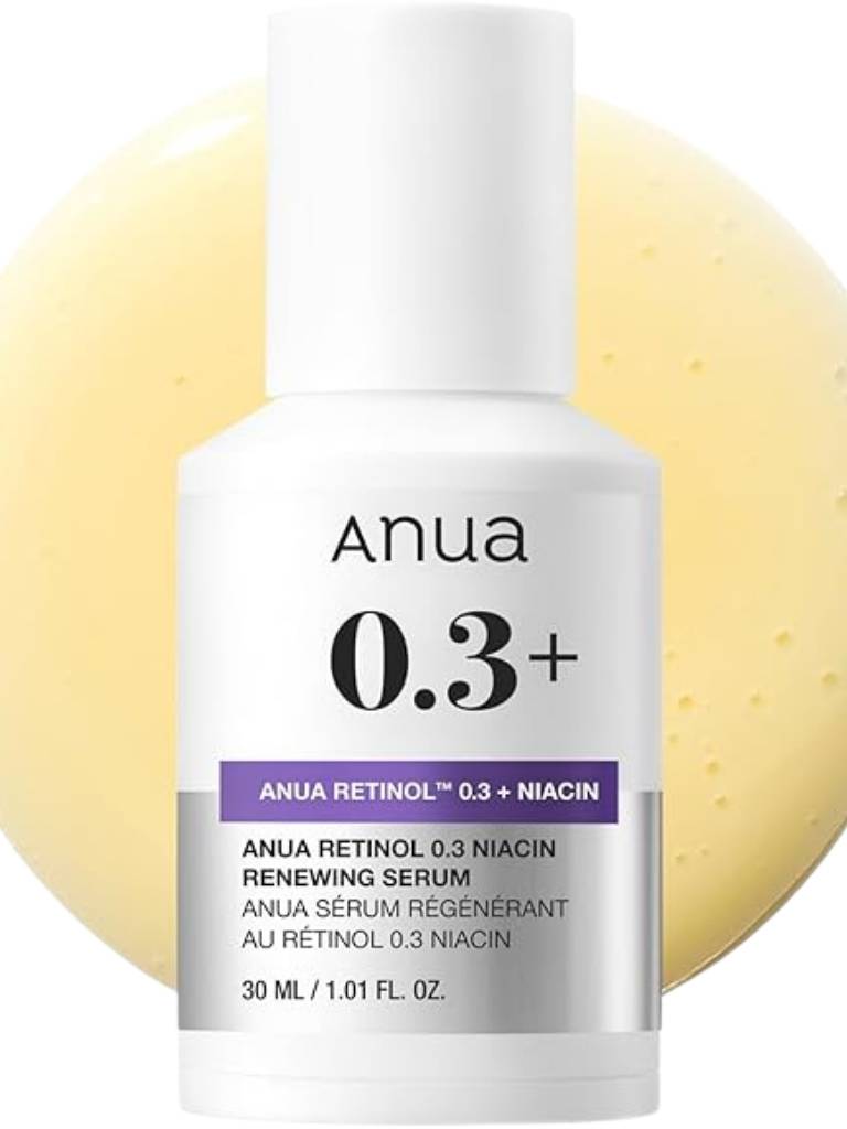 Anua 0.3+ skincare serum bottle with a yellow background