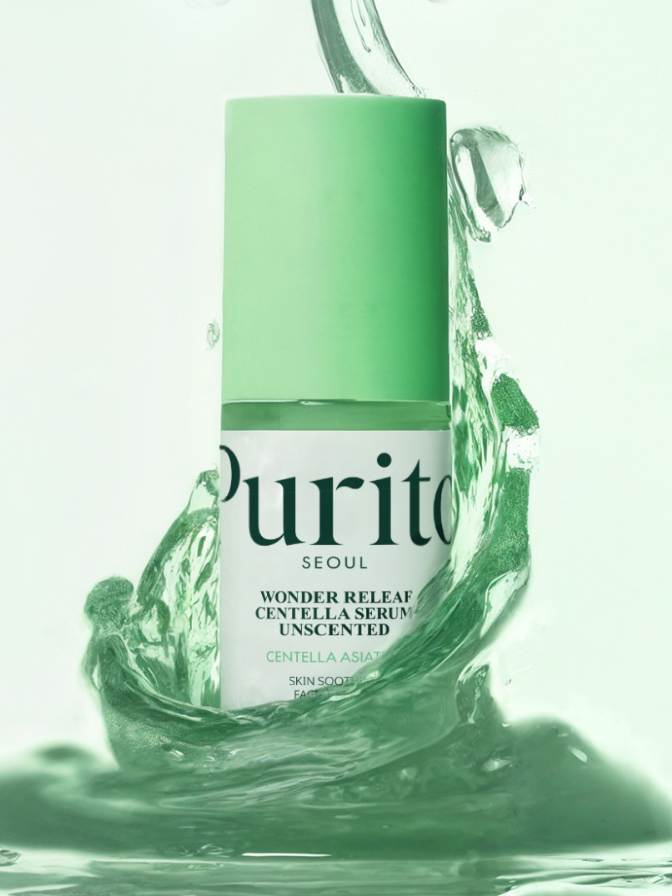 Green skincare serum bottle with water droplets on a white background