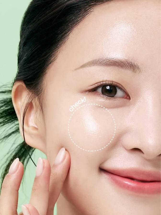 Close-up of a person's face with a green background