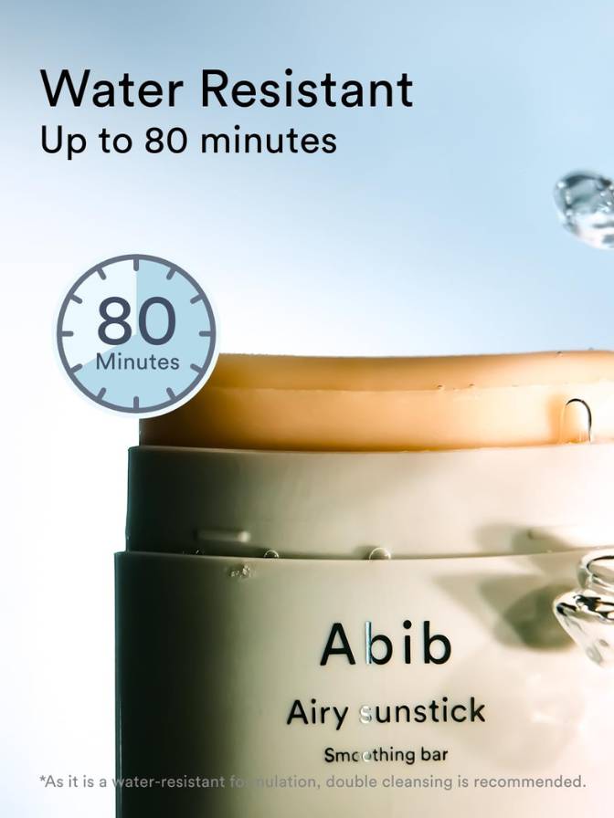 Abib airy sunstick with water droplet and text indicating water resistance on a light blue background