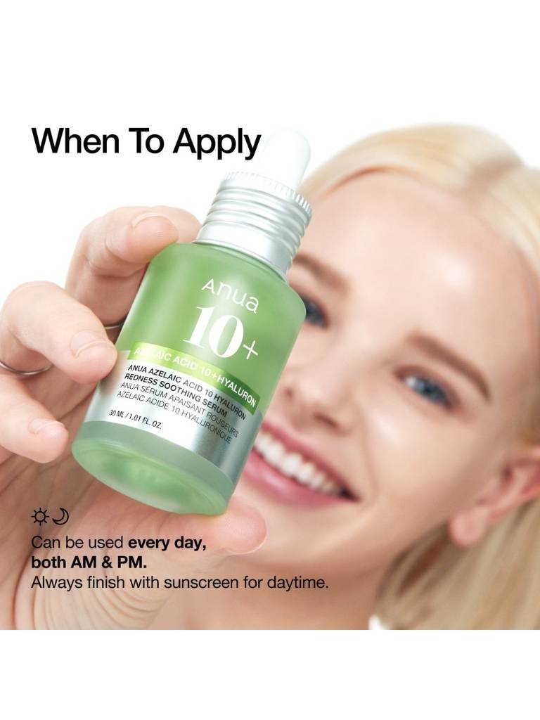 Person holding a skincare bottle with application instructions on a white background
