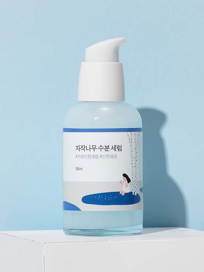 Skincare bottle with a blue label on a light blue background