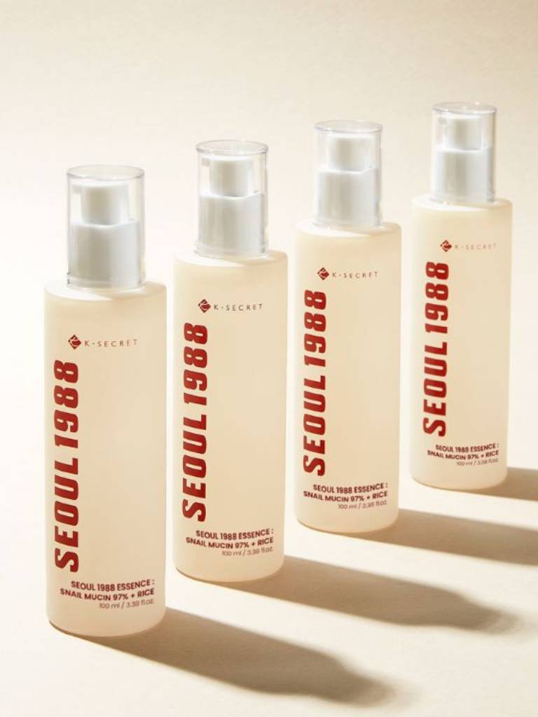 Four bottles of N-Secret Seoul 1988 skincare product on a light background
