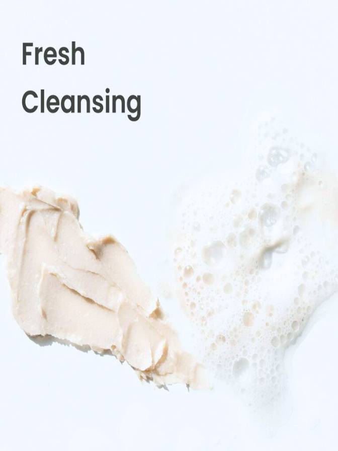 Close-up of a beige cleansing product with 'Fresh Cleansing' text on a light background