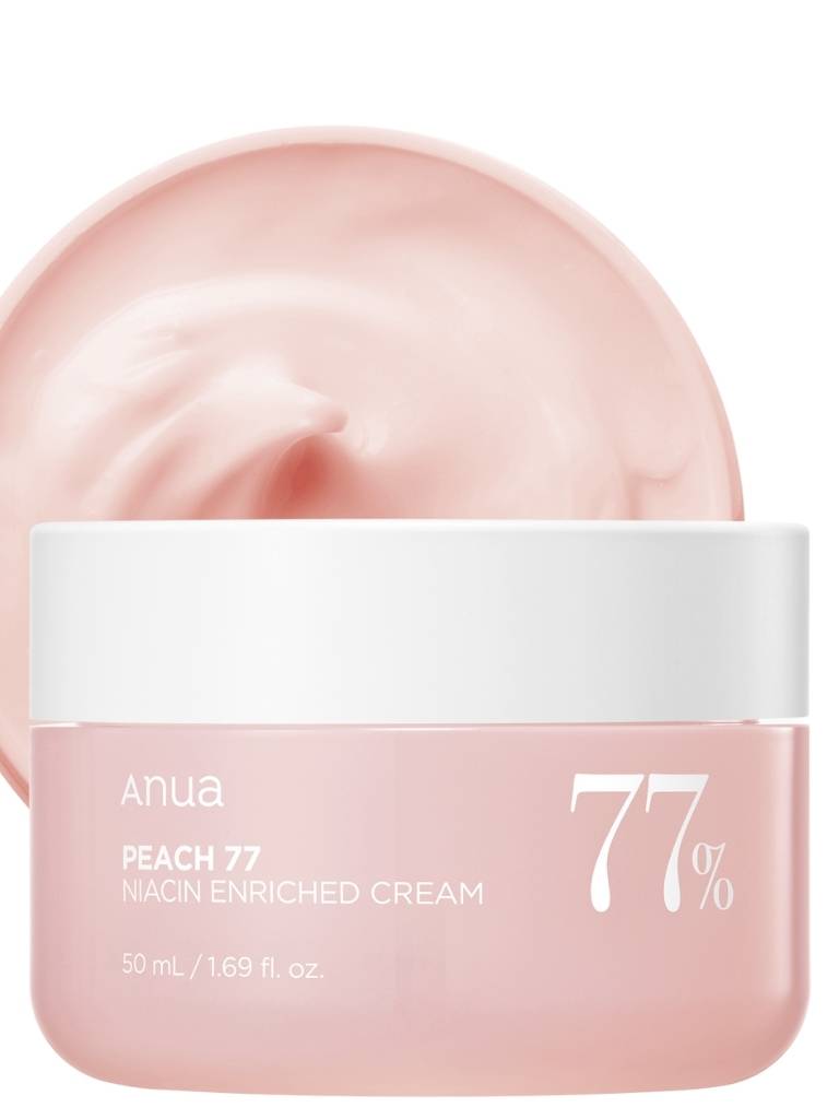Pink cream jar with white cap labeled 'Anua Peach 77 Niacin Enriched Cream' on a white background