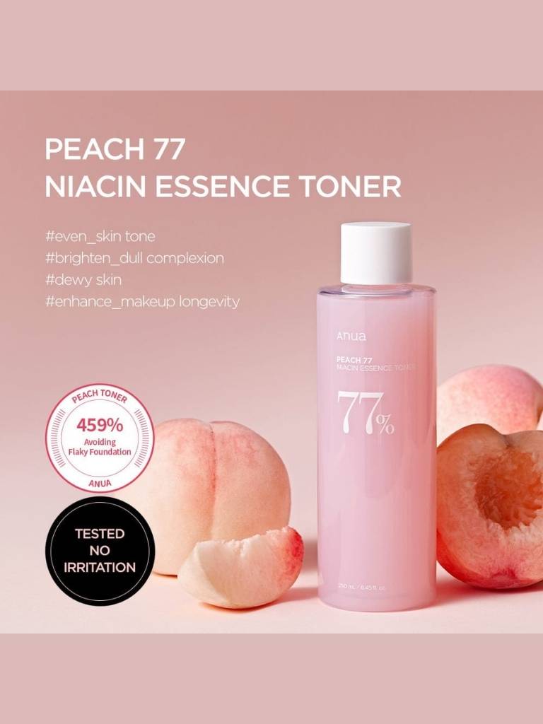 Peach 77 Niacin Essence Toner bottle with peaches on a pink background