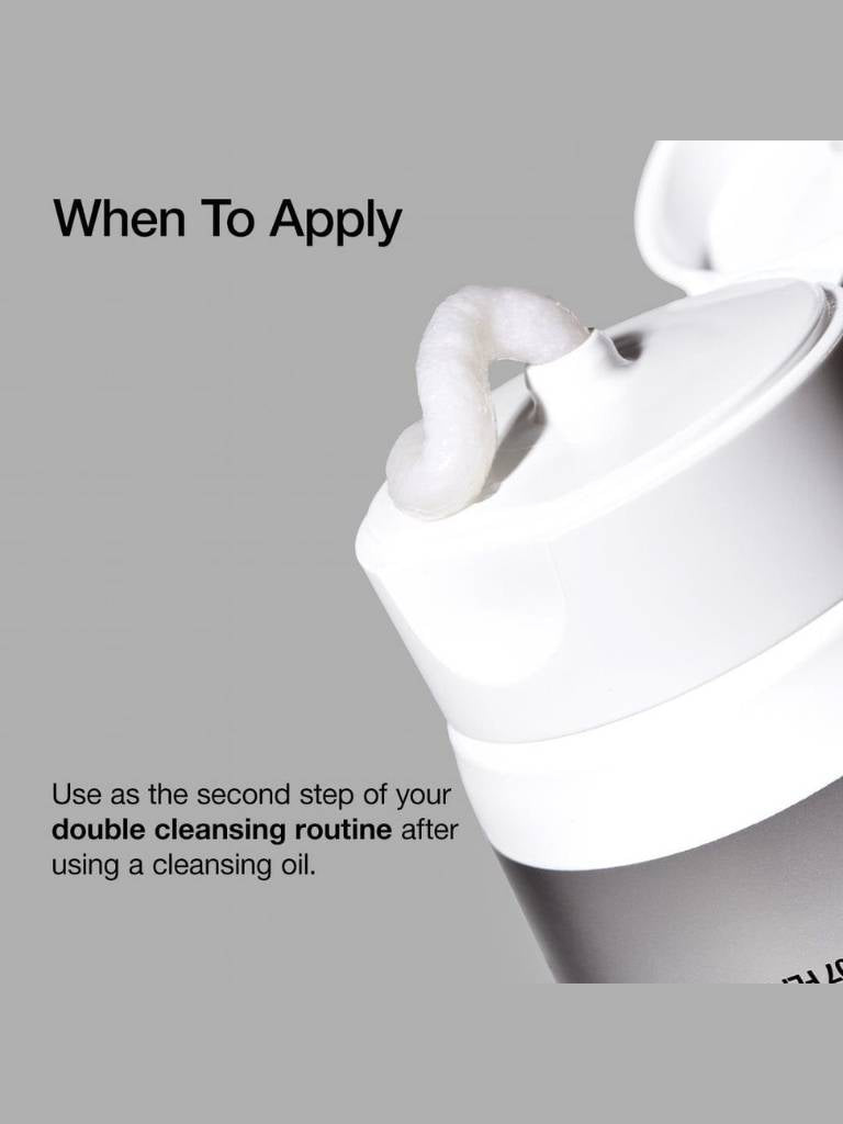 White facial mask with text on a gray background