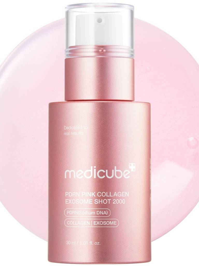 Pink skincare serum bottle with 'medicube' branding on a pink background