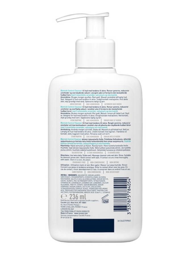 White bottle with pump and label on a white background