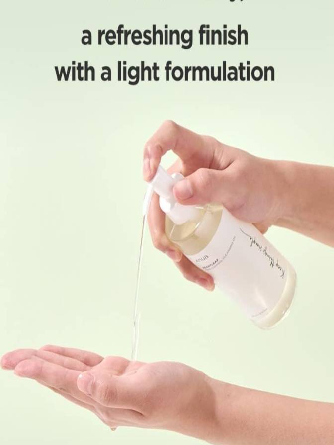 Hand holding a spray bottle with text 'a refreshing finish with a light formulation' on a light green background