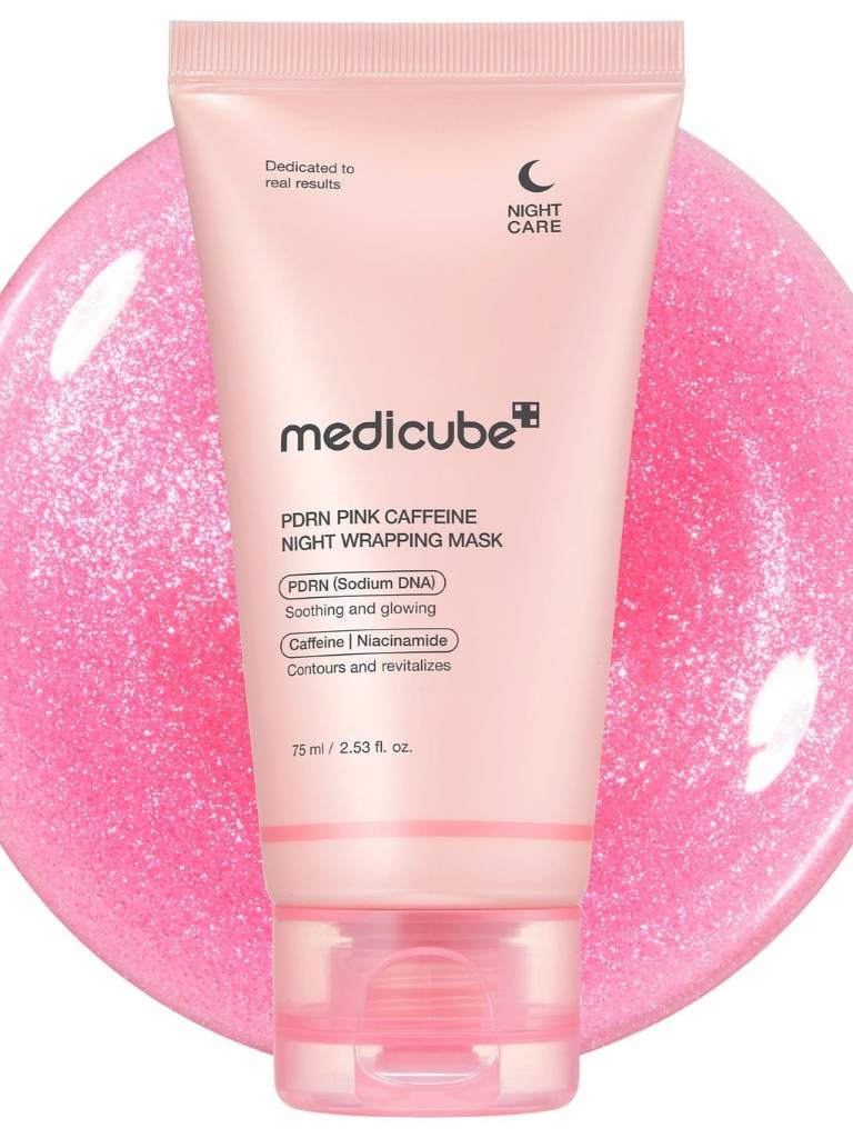 Pink skincare product with 'medicube' branding on a pink background