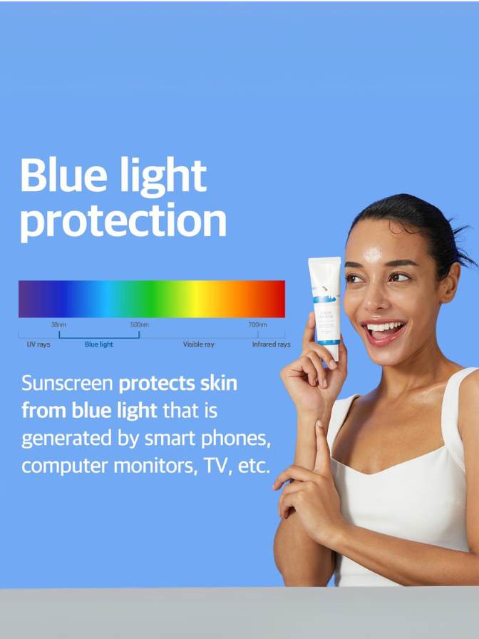 Woman holding a sunscreen tube with blue light protection label and color spectrum on a blue background