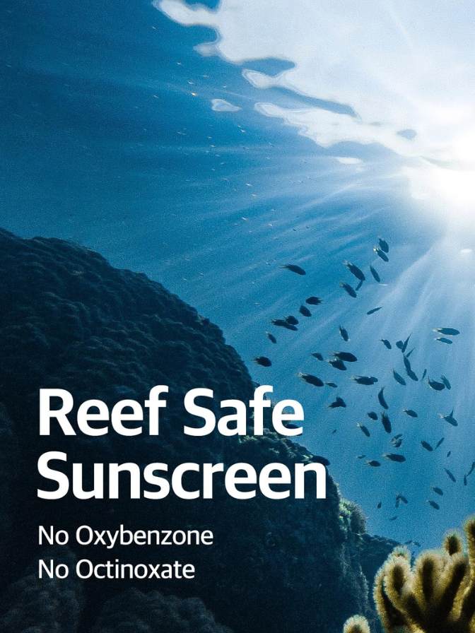 Underwater scene with fish and coral, promoting reef-safe sunscreen.