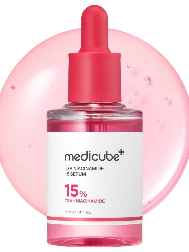 Medicube TXA Niacinamide 15% serum bottle with pink dropper on a white background