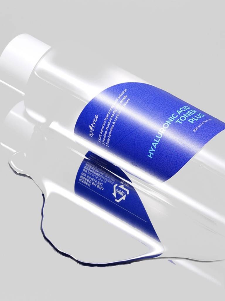 Hyaluronic acid toner bottle with blue label on a gray background