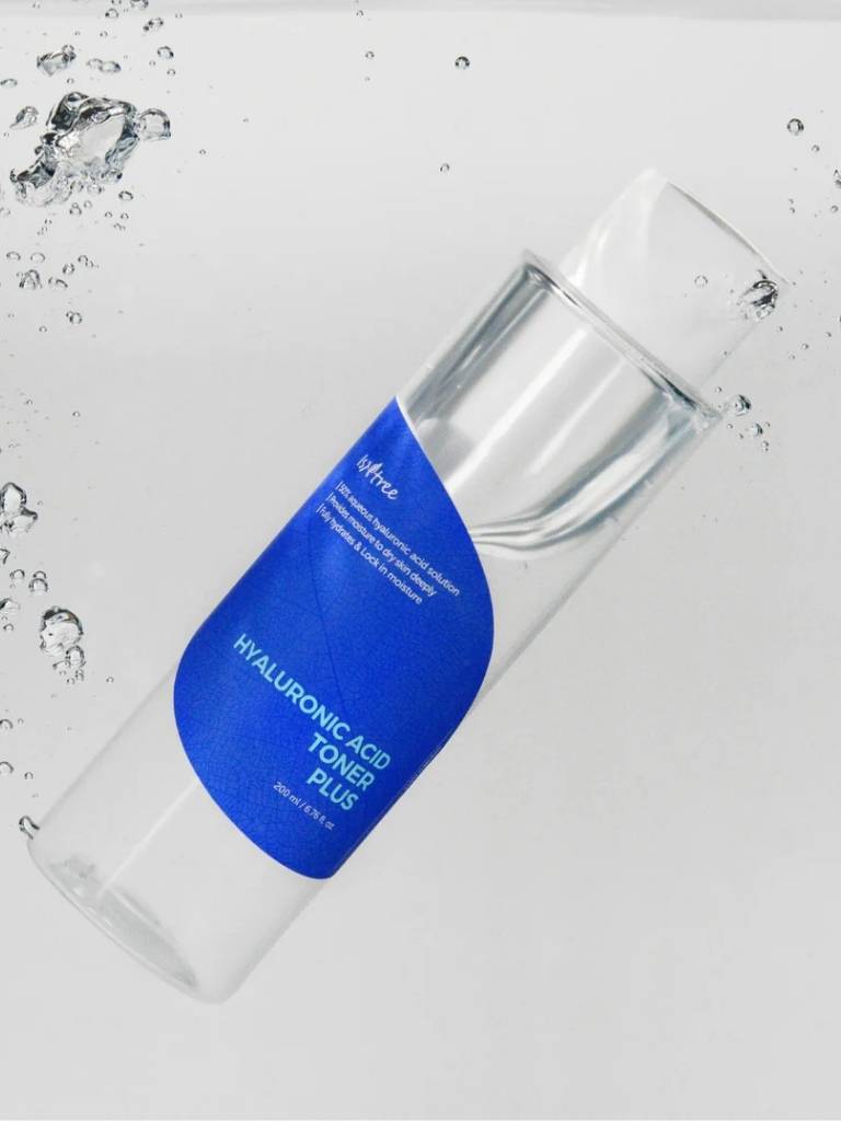 Clear bottle with blue label on a light gray background