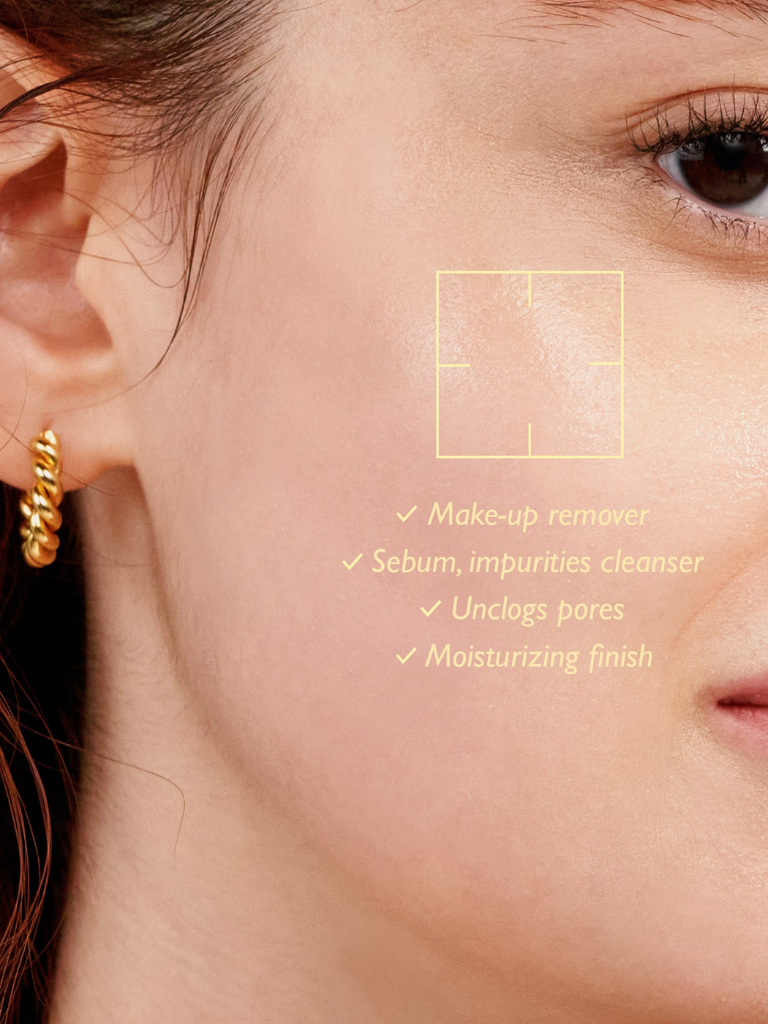 Close-up of a person's ear with a gold earring, focusing on skincare benefits.