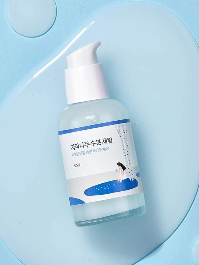 Skincare bottle with pump on a blue background