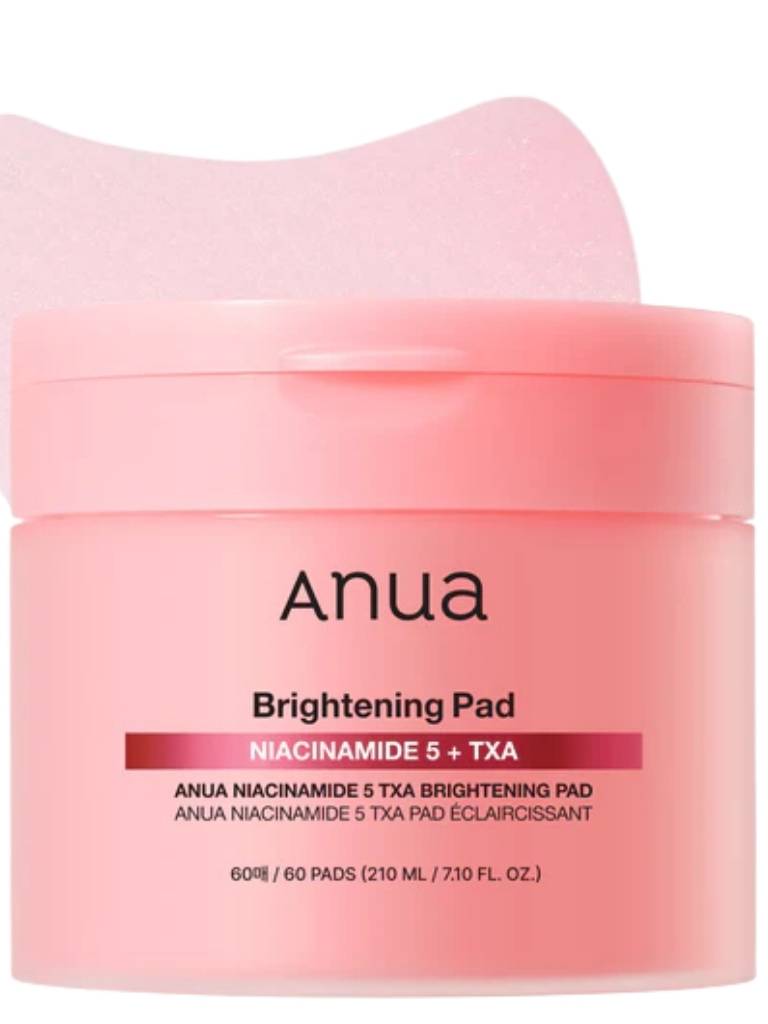 Pink jar of Anua Brightening Pad with a white lid on a white background