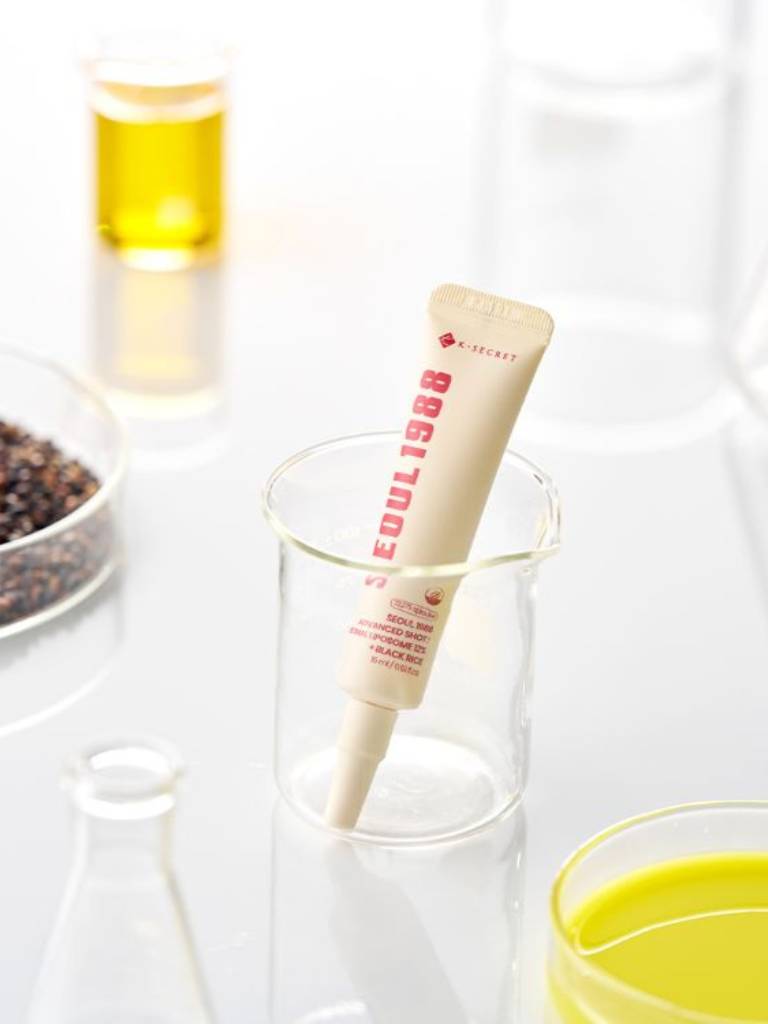 Tube of k-secret product in a glass with a blurred background