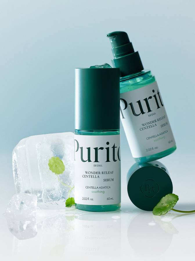 Two Purito skincare products on a light blue background with ice cubes and green leaves.