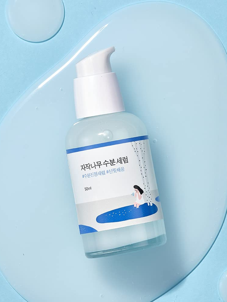Skincare bottle with blue label on a light blue background