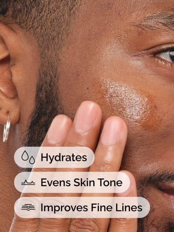 Close-up of a person applying skincare product to another person's face with text indicating benefits.