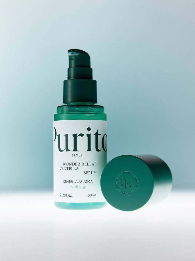 Purito serum bottle with pump on a light blue background