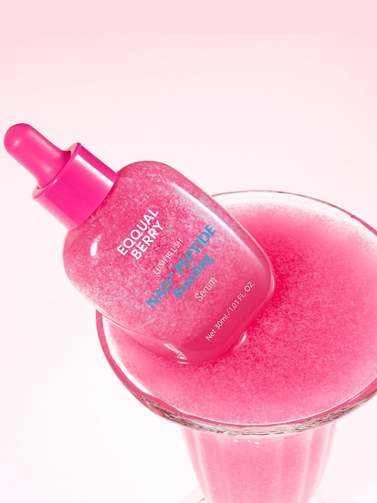 Pink skincare serum bottle with dropper on a white background