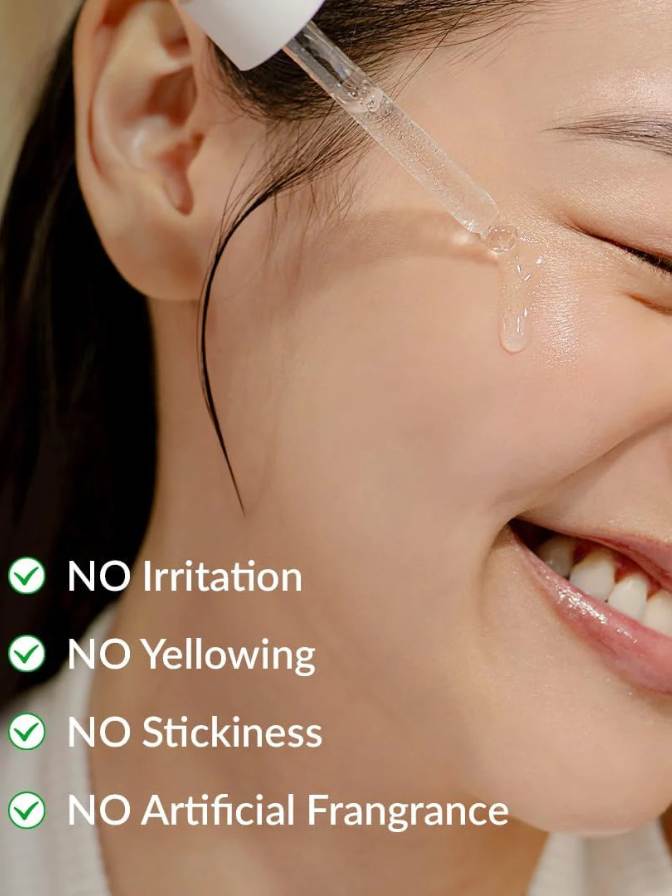Person using a dropper on their face with product benefits listed.