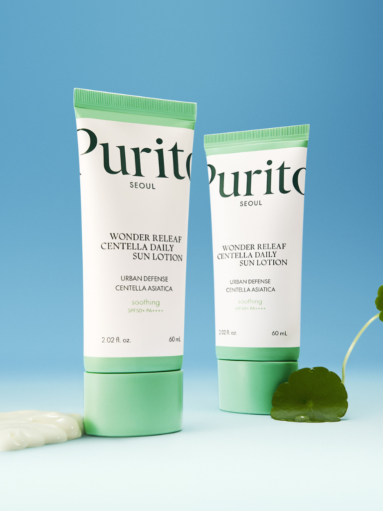 Two tubes of Purito Wonder Relief Centella Daily Sun Lotion on a light blue background