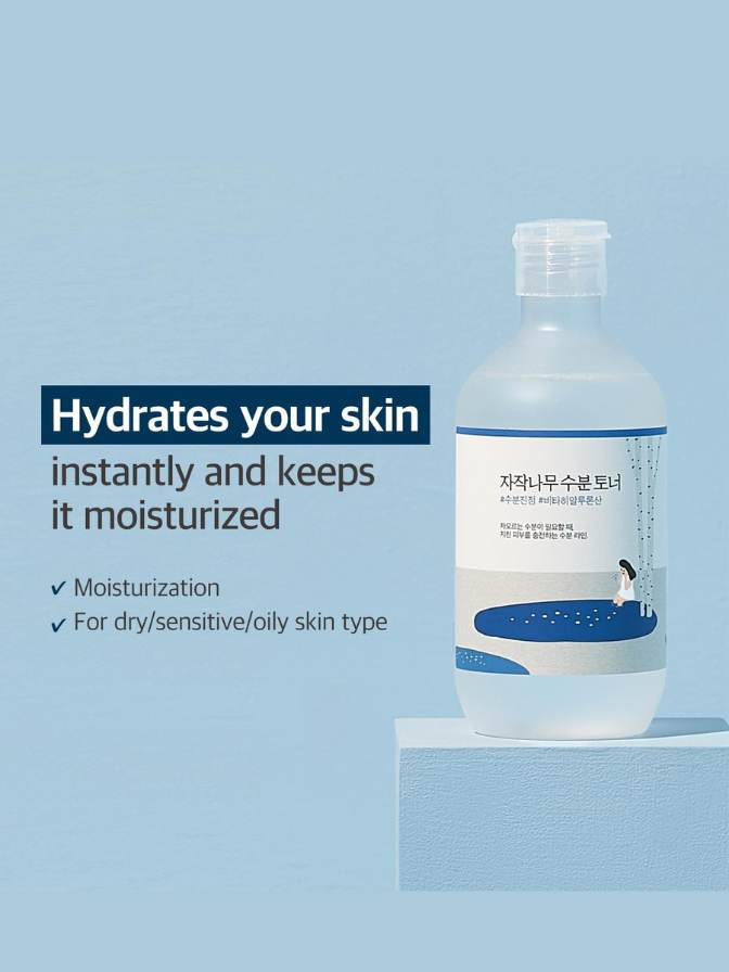Bottle of skincare product with text on a light blue background