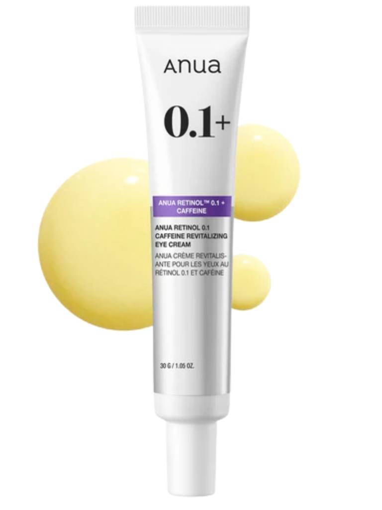 Anua eye cream tube with yellow spheres on a white background