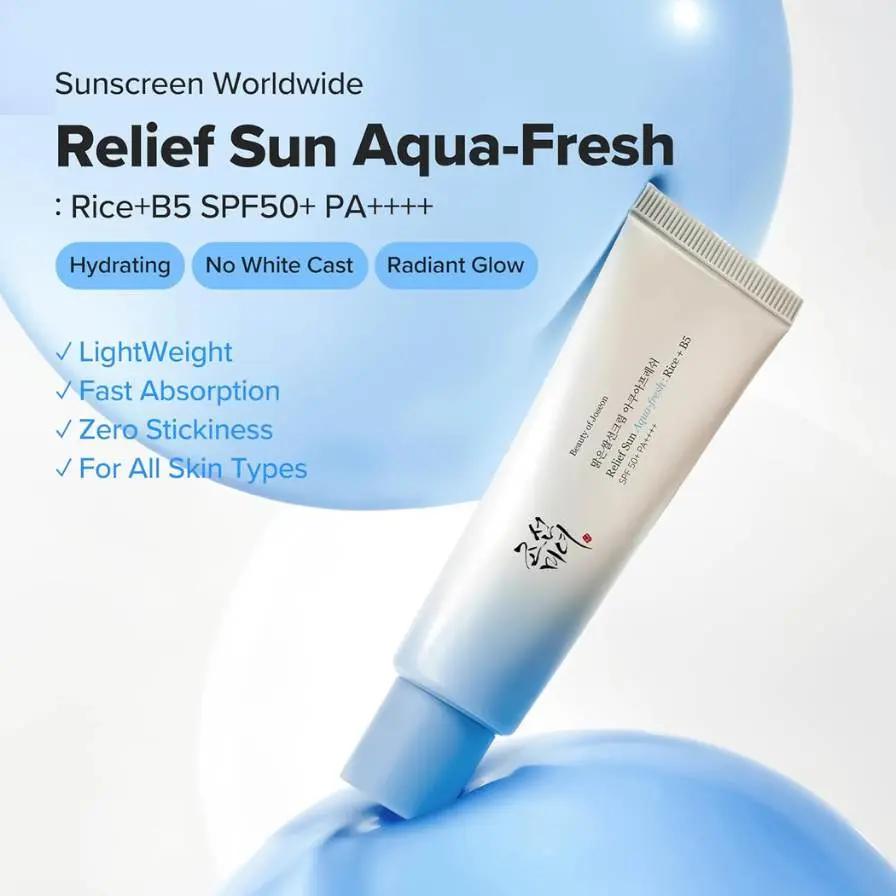 Sunscreen tube labeled 'Relief Sun Aqua-Fresh' with product features on a light blue background