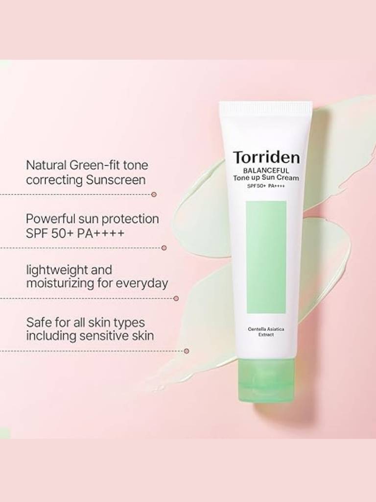 Torriden sunscreen tube with product details on a pink background