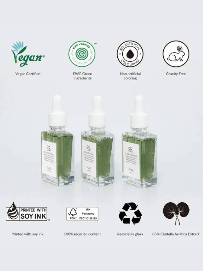 Three green bottles with labels and certification icons on a white background