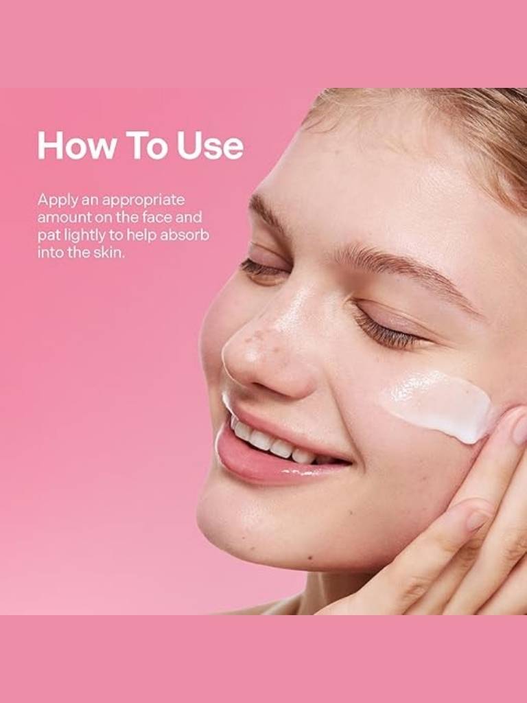 Woman applying cream to her face with text on a pink background