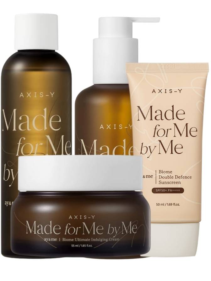 Collection of AXIS-Y skincare products including bottles and a cream on a white background.