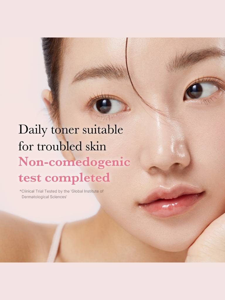 Advertisement for a daily toner suitable for troubled skin with a close-up of a person's face.