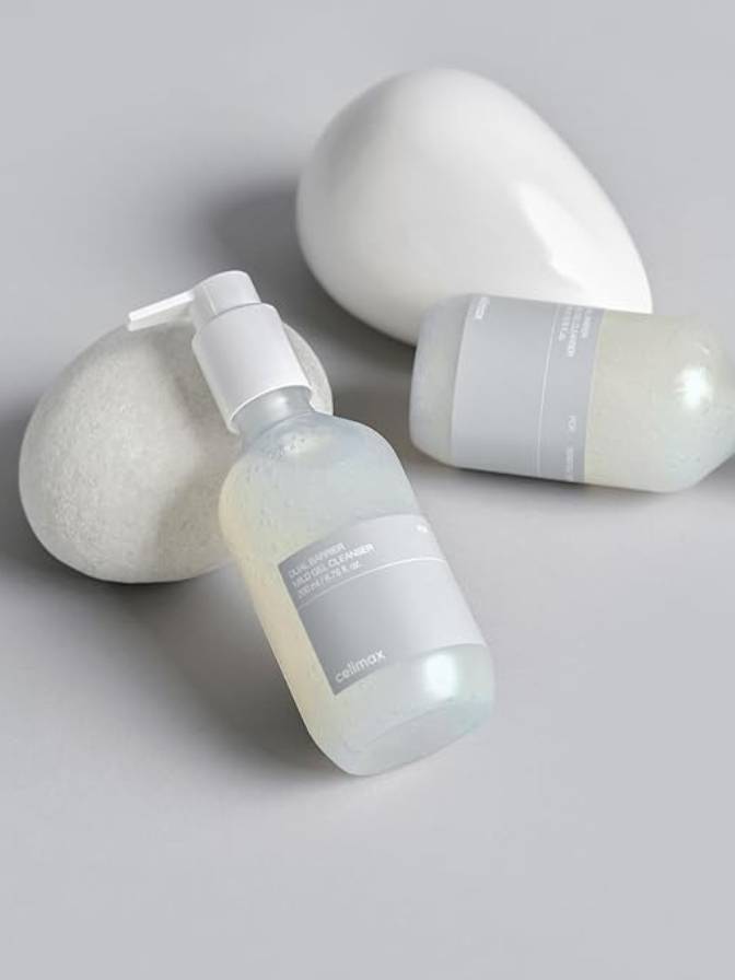 Skincare bottles with labels on a light gray background