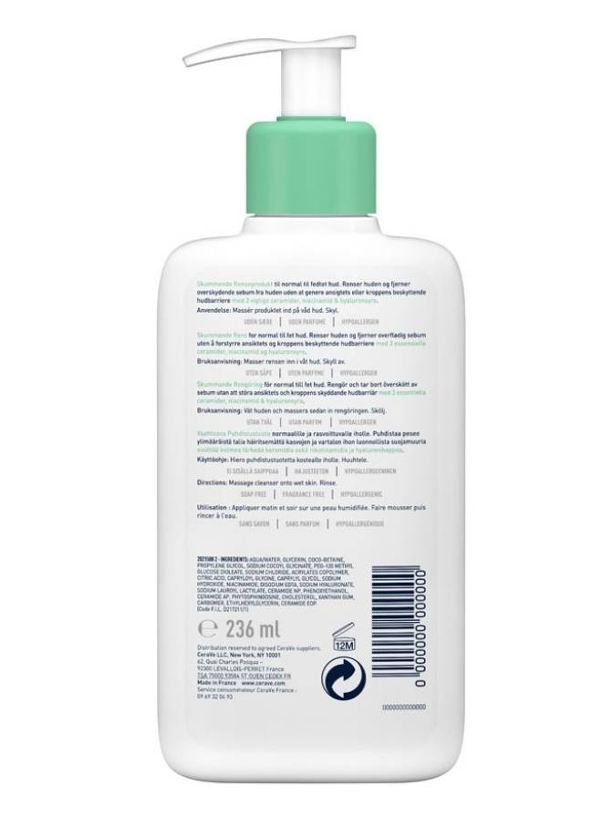 White bottle with green pump on a white background