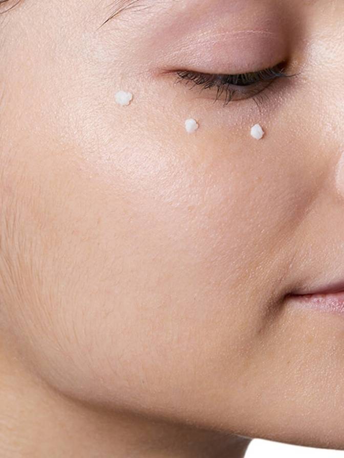 Close-up of a person's face with small droplets on the skin