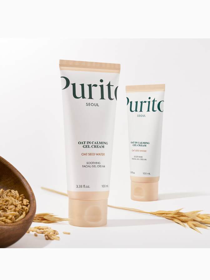 Two tubes of Purito oat cleansing gel cream on a white background with oats and a wooden bowl.