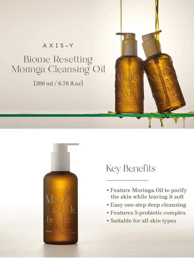 Two bottles of AXIS-Y Moringa Cleansing Oil on a glass shelf with product details and benefits listed.