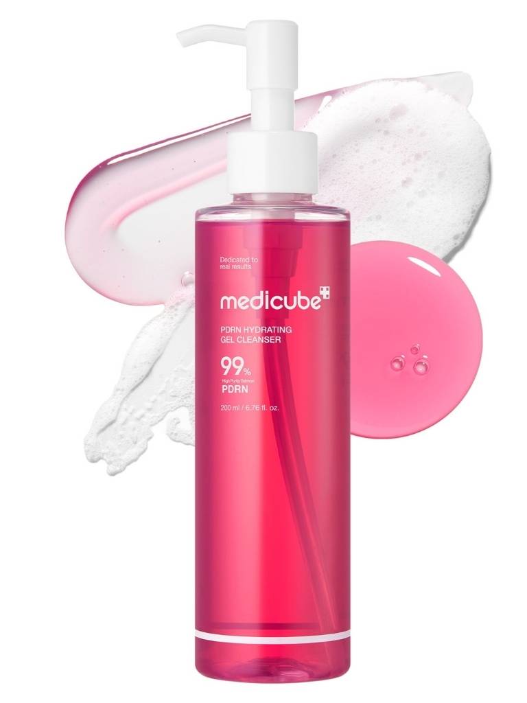 Pink bottle of Medicube cleanser with pump and pink gel on a white background