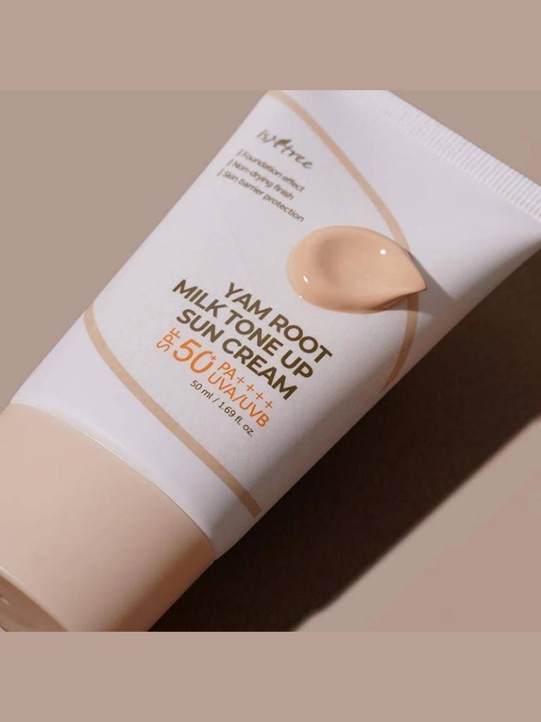 Yam root milk tone sun cream tube with beige color swatch on a beige background