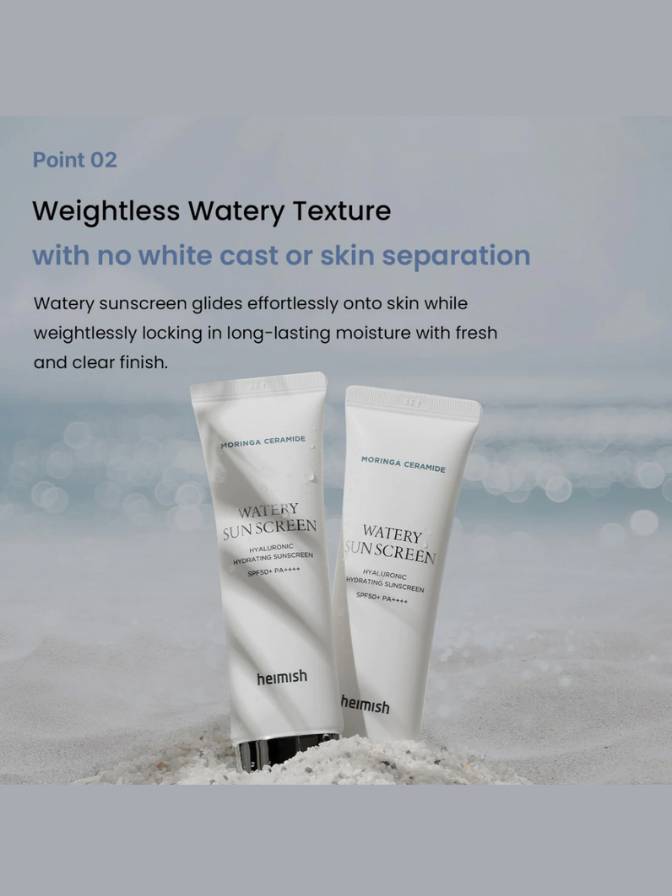Two tubes of Heimish Watery Sunscreen on a beach with a blurred background