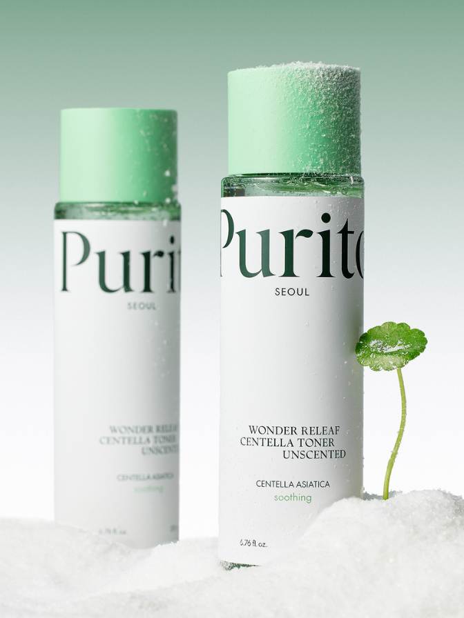Two bottles of Purito toner with a small plant on a light gray background