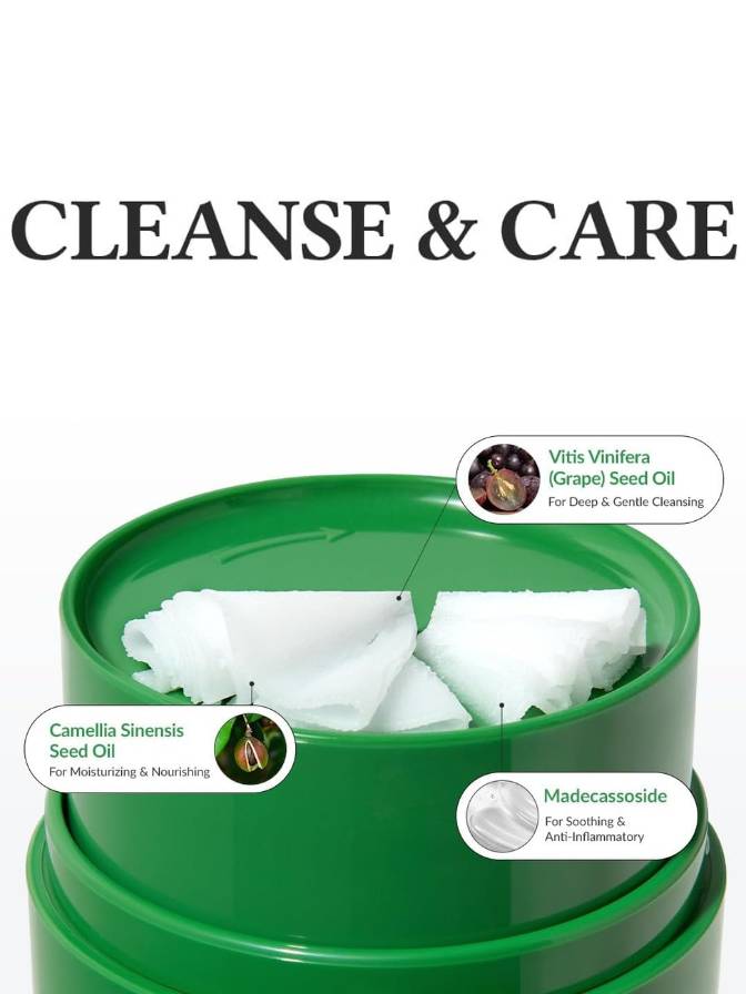 Green container with white cloths labeled 'Cleanse & Care' with various seed oils on a white background.